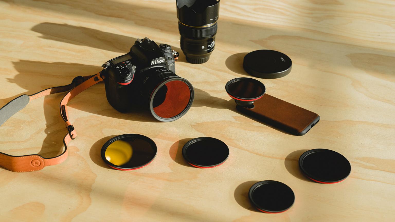 Moment VND Filters in various sizes with dark lighting - Moment CineClear UV snap-on filter lifestyle image in nature - Article called "The Ultimate Guide To Camera Filters and Filter Adapters"