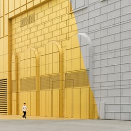 A man walks near the yellow walls of the Paradise Hotel in Incheon, South Korea