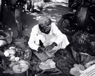 A street vendor preparing food in India.