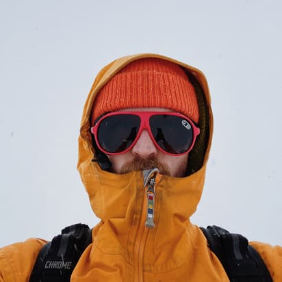 Caleb Babcock in winter coat and ski goggles 1