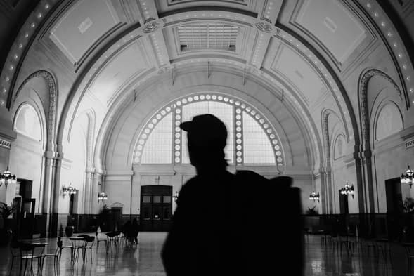 Black and white frame of a silhouette at the Seattle train station.