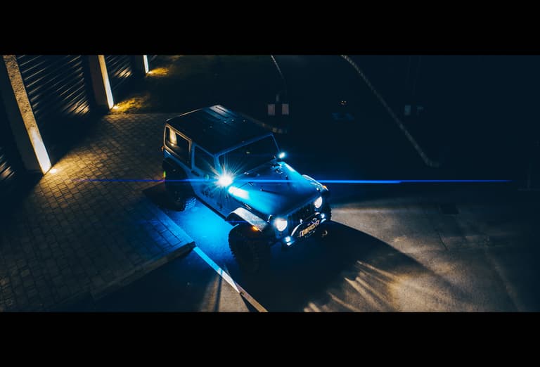 Moment drone anamorphic blue flare jeep parkinglot