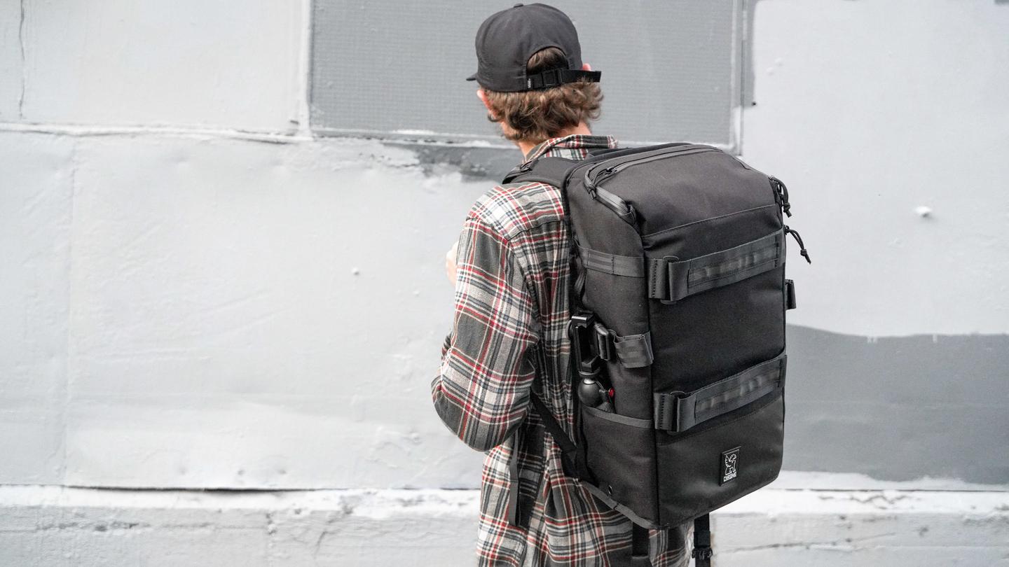 Chrome Backpack - The pack set neatly against the back of a man for full view.