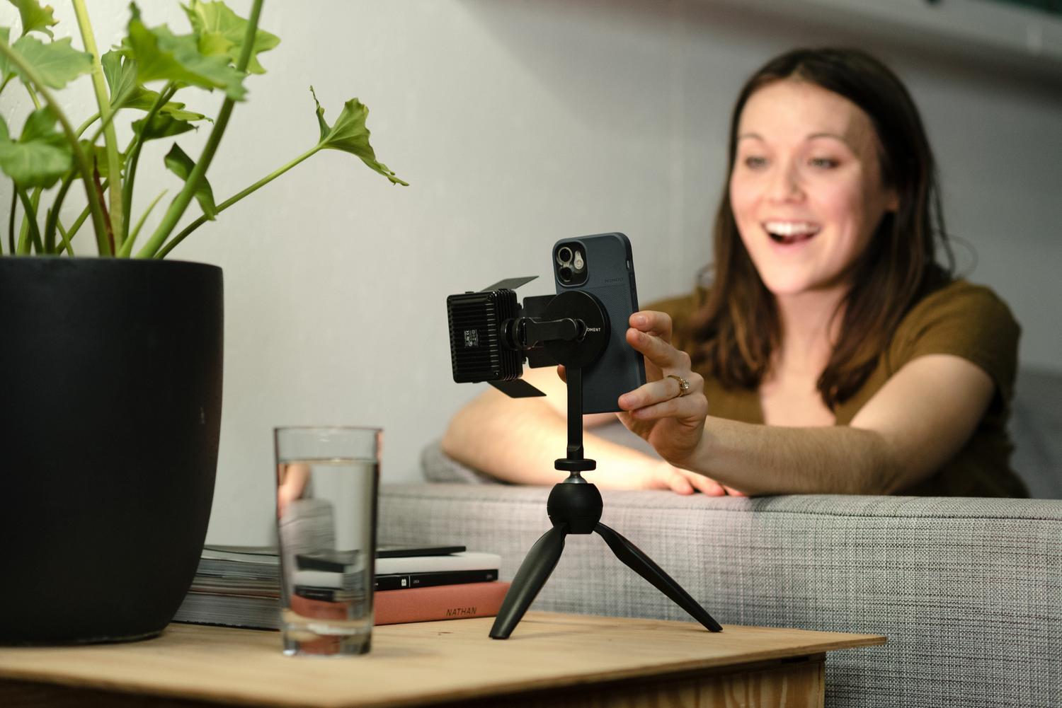MagSafe - Woman laughing using her tripod mount.