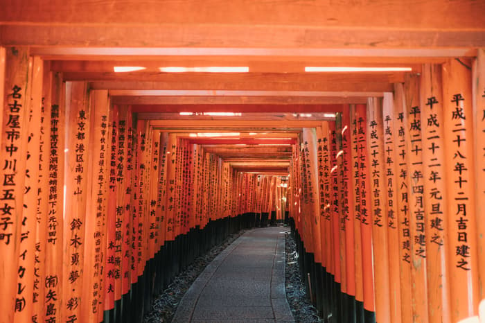 The iconic orange Fushimi Inari Shrine in Kyoto, Japan taken by Erica Coble @filmandpixel