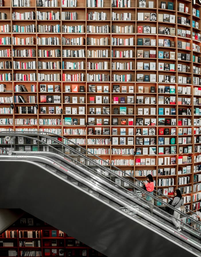 An escalator goes up along the many books of the Starfield library in South Korea